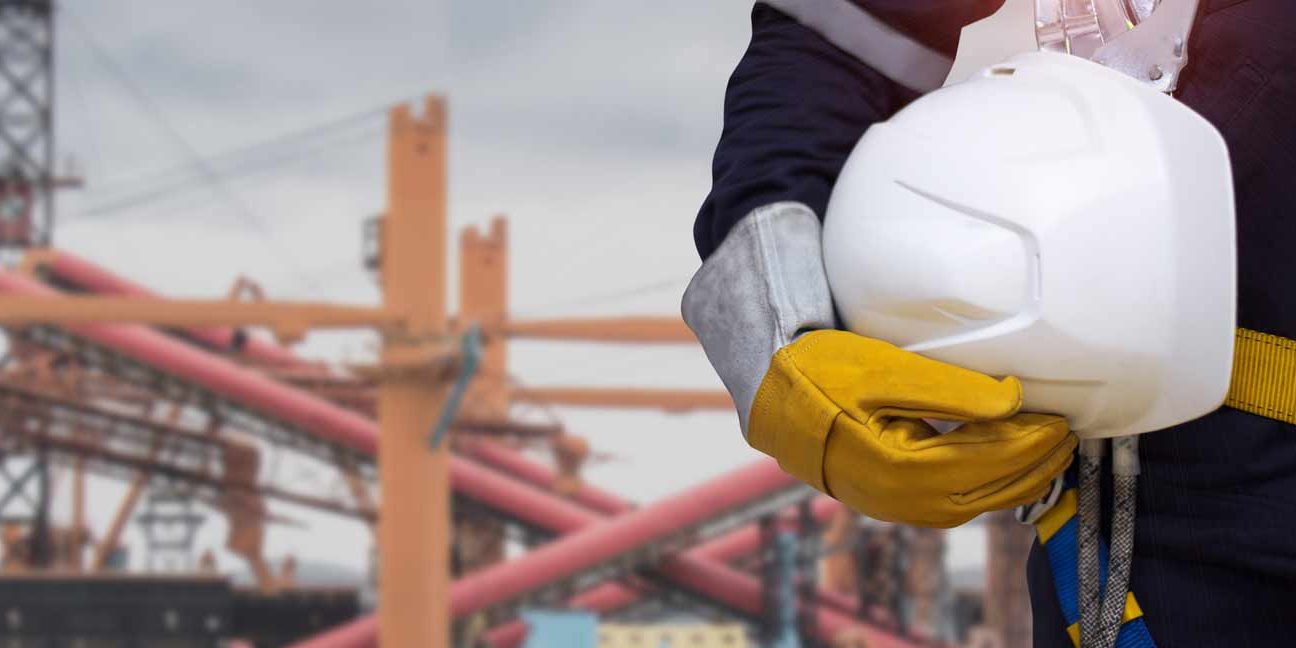 Engineer holding his helmet at the construction site | Employer’s Guide to Kenyan Labor Laws | Njaga & Co. Advocates employment and labour laws legal service