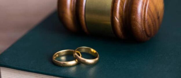 Double rings near a gavel | The Divorce Process in Kenya | Njaga & Co. Advocates family lawyer