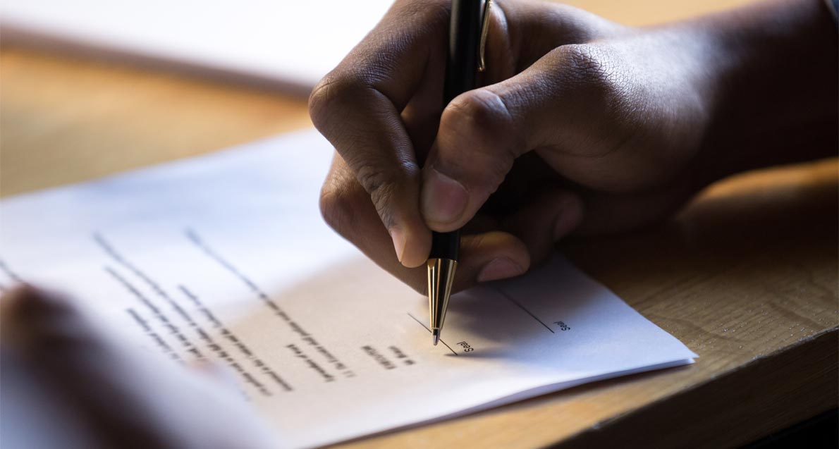 employment-contract A man's hand signing document | Employment Contracts | Njaga & Co. Advocates Employment law legal articles