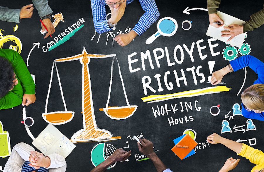 Illustration of employee rights, featuring a balance scale and keywords such as 'compensation' and 'working hours,' surrounded by diverse individuals collaborating| Employees’ Rights – Kenyan Labour Laws | Njaga Advocates employment law legal services