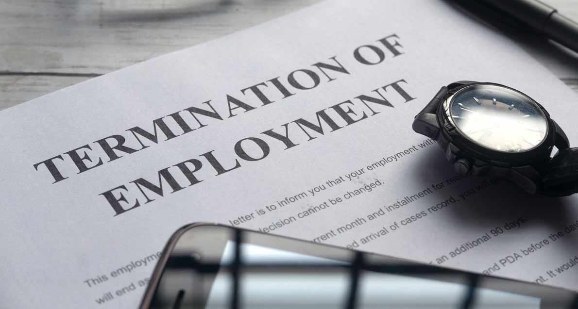 A termination of employment document with a smartphone and watch on it |Termination Under Kenyan Employment Law | Njaga & Co. Advocates employment law legal articles